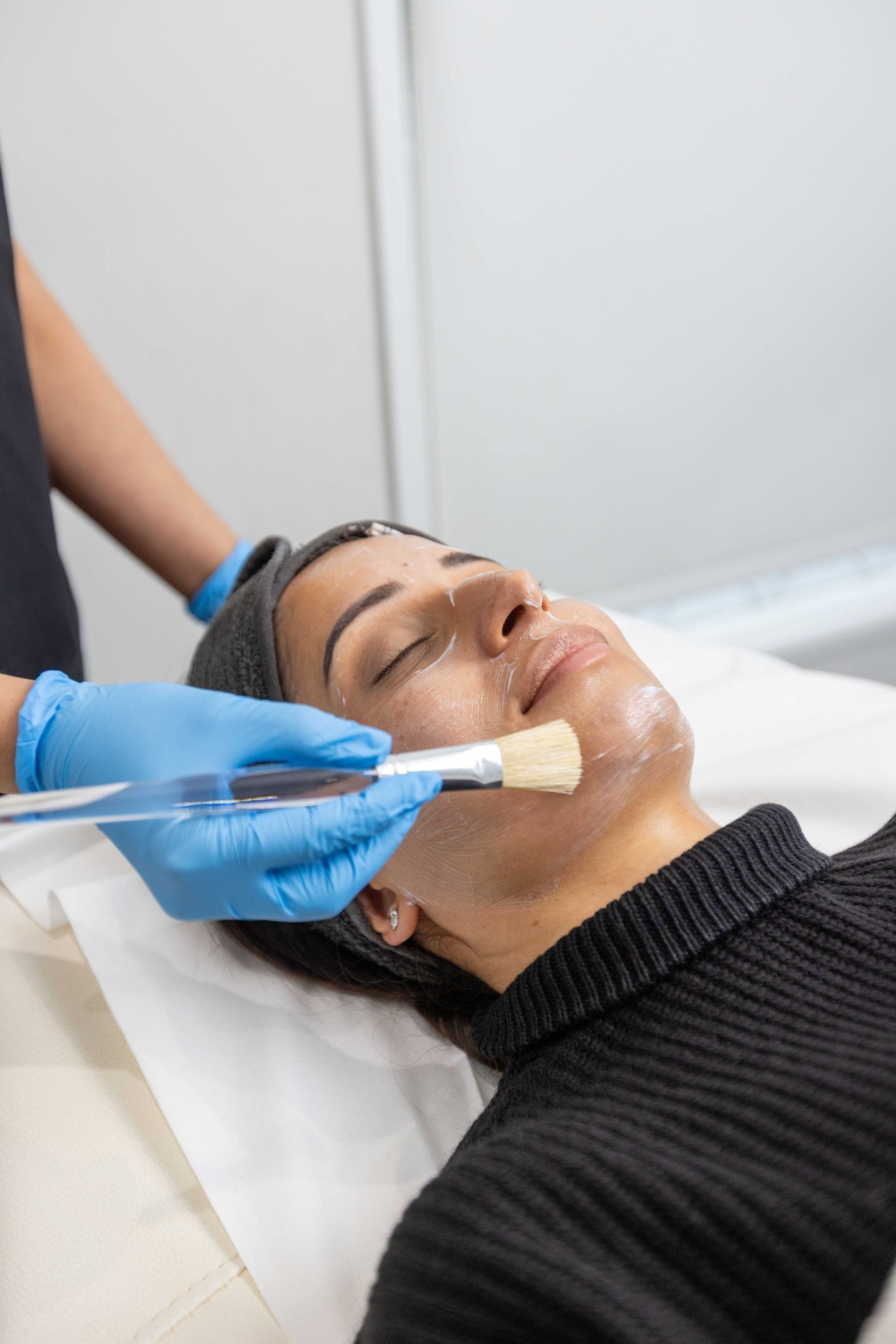 Facial treatment demonstration during mentoring session